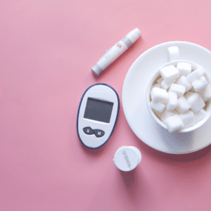 Blood sugar meter and a bowl of sugar cubes